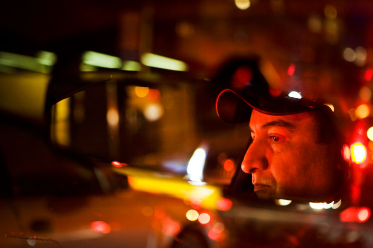 New York Taxi Driver in Drivers Mirror : Astoria, Queens : New York