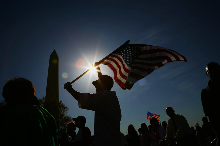 Stars and Stripes flying at Immigrant Rights March :  Washington DC : USA