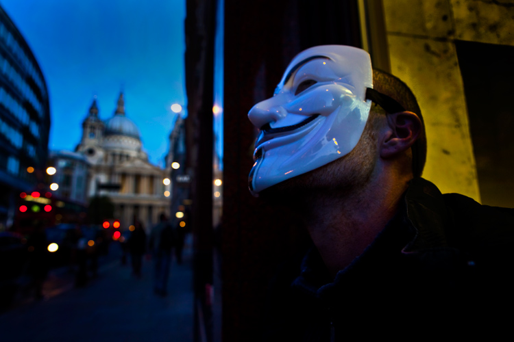 Global Crisis Personal Crisis : Homeless man Guy Fawkes Mask : City of London