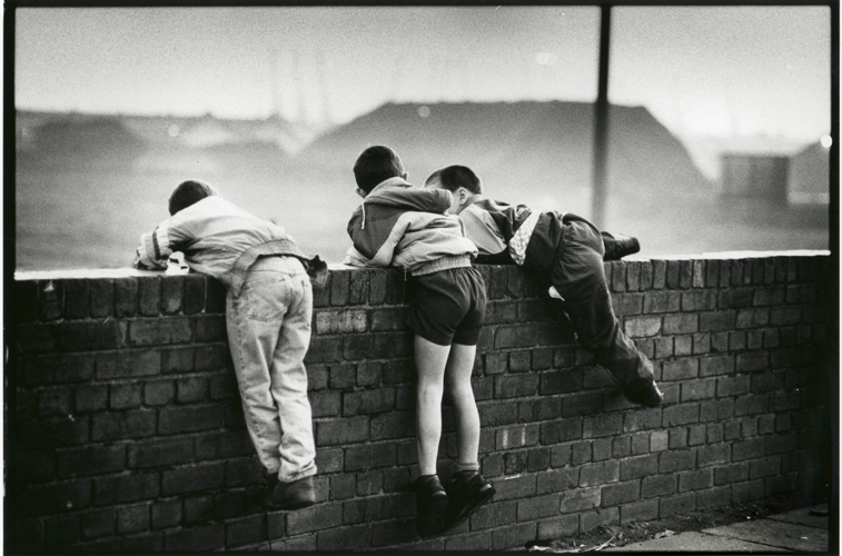 Boys Play Close to Coal Piles : Bootle : England UK