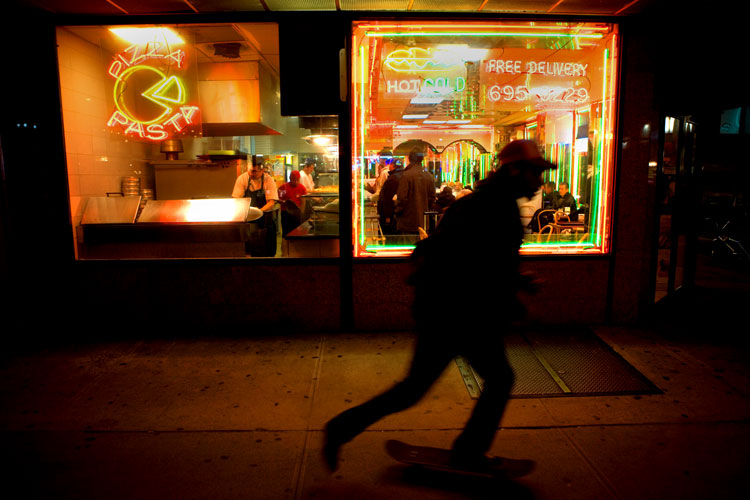 Skate boarder and Pizza shop : 7th Av Midtown : NYC