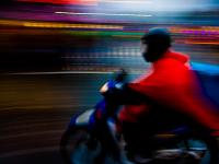 Biker in the Rain and Gloom of a London Afternoon : Camden : London