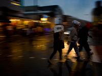 Shoppers Brave Rain and Storms : Camden Lock London : England UK